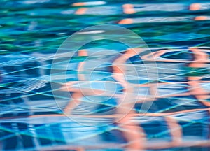 Background of rippled water in swimming pool