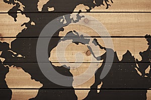 Background of rough wood plants with partial view of world map with oceans painted dark brown