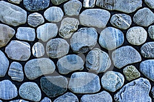 Background of rounded gray stones, pebbles, copy space