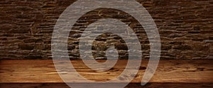 Rustic wooden table with stone wall
