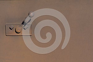 With rusty metal wall and lever