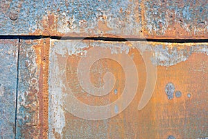 Background of rusty shell of ship at shipyard for maintenance