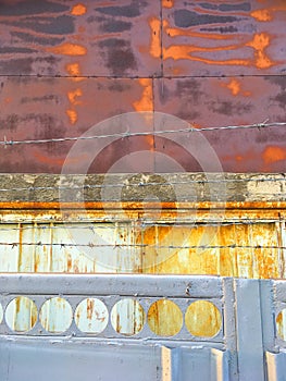Background rusty wall barbed wire