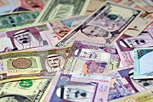 Background of Saudi Arabia riyals money banknotes bill and United States Of America dollars notes, American and Saudi money