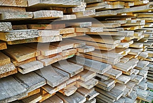 Background of sawn boards in a stack. lumber