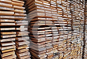 Background of sawn boards in a stack. lumber at a sawmill