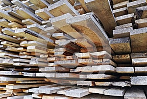 Background of sawn boards in a stack. lumber at a sawmill