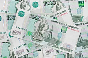 Background of scattered banknotes Russian ruble denomination one thousand rubles
