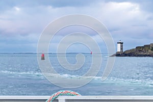 Background with sea and lighthouse on the coast of Brittany, Finistere, France