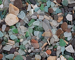 Background from sea pebbles with color of multi-colored glass