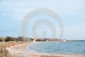 Background of a secluded sandy beach in pastel shades.