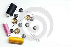 Background of sewing and needlework. Sewing tools top view isolated on white background.