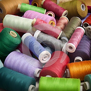 Background for sewing with spools of colorful thread