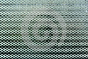 Background sheet of black metal steel of circular holes. Seamless surface stainless steel pattern design texture