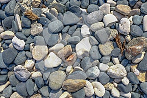 Background shot of smooth pebbles found on the beach.