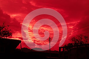 Background of sky with red clouds on the coutryside.