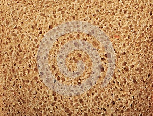 Background of slice of bread - black rye bread with yeast