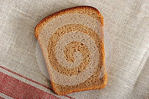 Background of slice of bread - black rye bread with yeast