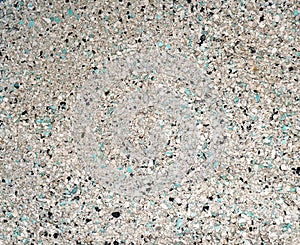Background of small blue, gray, white and black small granules (