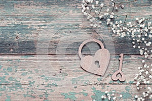 Background with small white flowers, lock-heart and keyon old bo