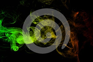 Background smoke curves and wave reggae colors green, yellow, red colored in flag of reggae music