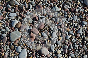 Background of smooth wet gravel and pebbles