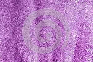 Background of soft, fluffy knit fabric. Lilac knitted texture