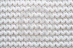 Background of soft white knitted fabric, machine-knitted wool sweater texture close-up, wallpaper concept, wrapping paper, winter