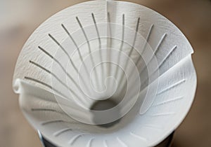 The background is softly blurred, emphasizing the central focus on the filter