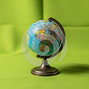 Background is a solid green, providing a stark contrast to the