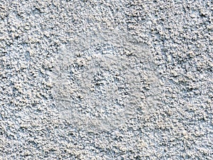 Background from solid material. Pimply white wall. Uneven wall surface