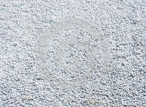 Background from solid material. Pimply white wall. Uneven wall surface