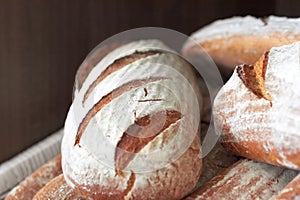 Background, sourdough bread or closeup in bakery of fresh loaves, carbs and rustic grain for nutrition. Artisan