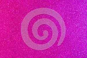 Background with sparkles. Backdrop with glitter. Shiny textured surface. Strong pink