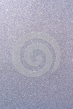 Background with sparkles. Backdrop with glitter. Shiny textured surface. Vertical image. Dark grayish blue