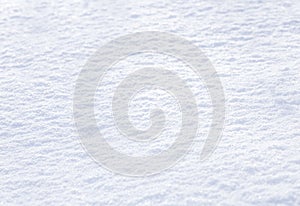 Background of sparkling fresh snow texture. Winter fresh white snow in sunlight.