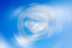 Background with spin radial blur effect of blue cloudy sky