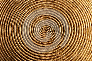 Background of a spiral woven wicker texture - Detail of a basket