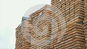 Background of the square ends of the wooden bars. Wood timber construction material for background and texture. close up