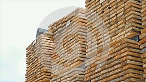 Background of the square ends of the wooden bars. Wood timber construction material for background and texture. close up