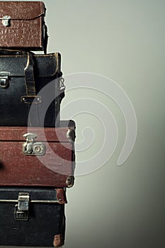 Background stack of old suitcases form a tower
