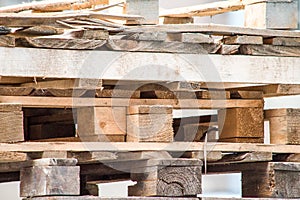 Background of a stack of old wooden pallets