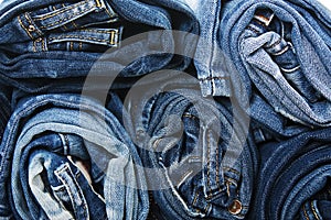 Background of a stack rolled jeans