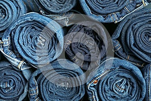 Background of a stack rolled jeans