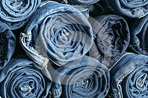 Background of a stack rolled jeans
