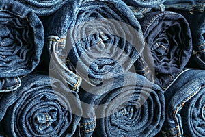 Background of a stack rolled jeans
