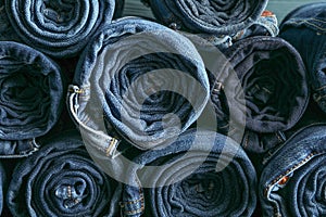 Background of a stack rolled jeans