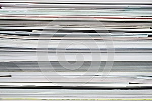 Background from stacked magazines, brochures, notebooks, catalogs