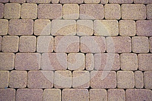 Background stone pavement. road paved with cobbles. texture of bricks.