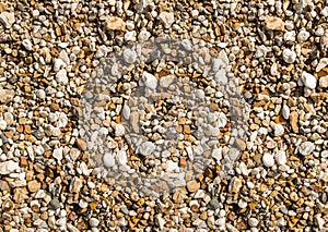 Background stone small pebble beige brown natural texture, sea beach